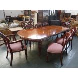 A set of ten Victorian mahogany dining chairs hoop backs on fluted legs to include two carvers