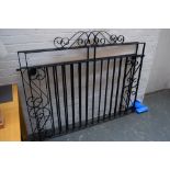 A pair of black painted iron gates 145cm long 110cm high each