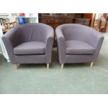 A pair of contemporary tub chairs in grey fabric on beech legs