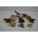 A collection of Wade Whimsies including a giraffe, pigs, tropical fish, sheep, cow, fox,