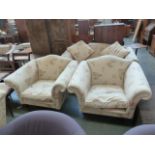 A Laura Ashley three piece suite including a two seater sofa and two armchairs each with shield