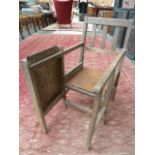 A Palatine Company oak child's chair with occasional tray