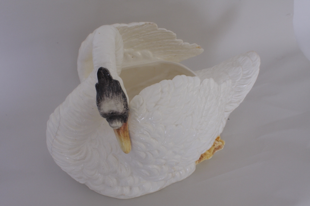 A mid Victorian Staffordshire jardiniere in the form of a naturalistic swan,