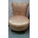 A 20th century oak nursing chair with pink floral silk fabric