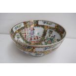 A large famille rose serving bowl in typical palette decorated with floral,