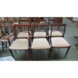A set of six mahogany bar back dining chairs on fluted legs including two carvers,