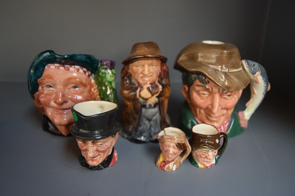 A small collection of Toby jugs including Royal Doulton 'The Poacher' (6)