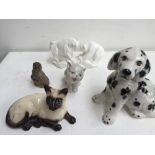 Five ceramic figurines including: a Royal Doulton Siamese cat model 1559,