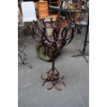 A metal pot stand made with horse shoes 80cmH