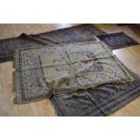 Three oriental rugs including a Caucasion runner,