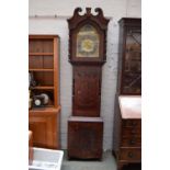 An early 19th century mahogany longcase clock with eight day movement brass face and silvered