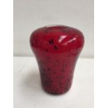 An Art glass vase red ground with splashes of black glitter and white interior,