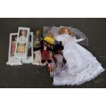 A collection of dolls including a "golly" doll, two classic collection porcelain dolls,