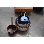 A selection of saucepans including four enamel pots,