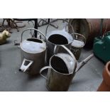 Four vintage metal watering cans