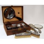 A mid 20th century ebony and chrome plated gents travelling toilet set in a simulated crocodile
