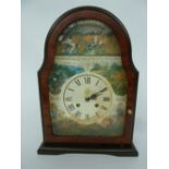 A mantle clock depicting scenes of the countryside including fox, pheasants, ducks and deer,