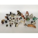 A selection of ceramic and glass animal figurines to include a Royal Crown Derby duck and