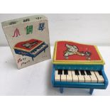 A vintage 8 keys Baby piano UC 538