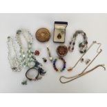 A selection of costume jewellery including necklaces, earrings, brooches,