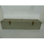 A green painted wooden case with brass fixings and side handles 107 x 24 x 23cm