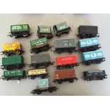 A quantity of mainly Tri-ang railways `00` gauge transport wagons including a container ,
