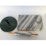 A Marble rolling pin together with a marble cheese board 30 cm diameter and a marble chopping board