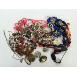 A quantity of costume jewellery mainly necklaces and brooches