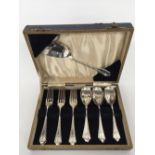 A cased set of Art Deco silver plated forks and spoons, retailed by W.