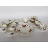 A Royal Crown Derby " Derby Posies" part tea service including cups, saucers, side plates, milk jug,