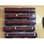 Five Tri-Ang 00 Gauge carriage car in maroon including two guard cars