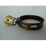 A Victorian brass dog collar with padlock approximately 6cm diameter