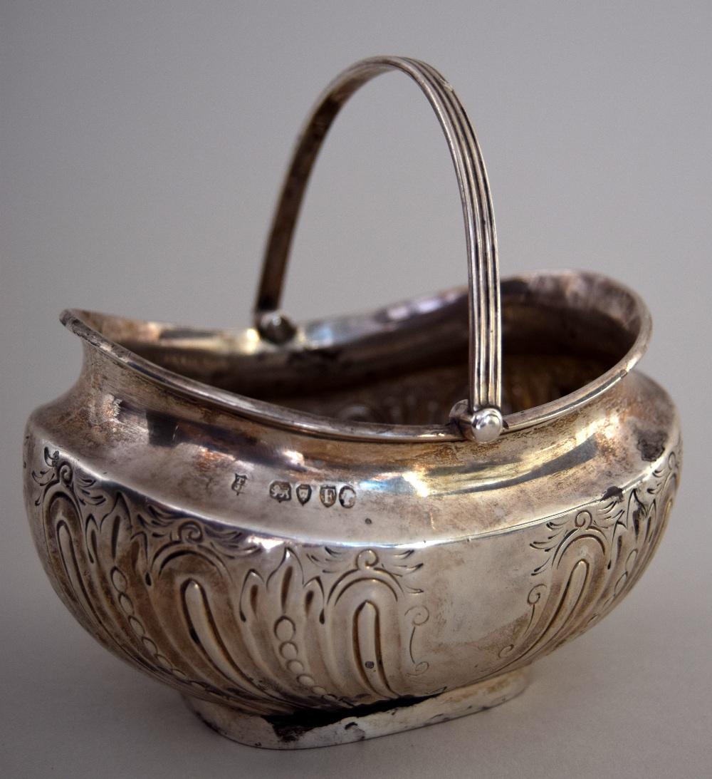 A Victorian silver plated bonbon dish with engraved decorations and swing handle by Thomas Bradbury