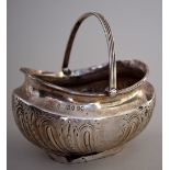 A Victorian silver plated bonbon dish with engraved decorations and swing handle by Thomas Bradbury