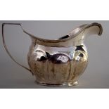 A George III silver cream jug, London 1806, 9cmH, 3.