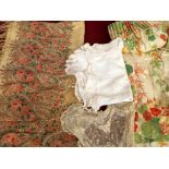 A mixed lot to include linen and tableware, a cream wool shawl with floral bordering and fringe,