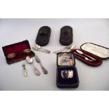 A quantity of silver and silver plated items including a napkin ring, a pair of open salt cases,