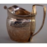 A George III silver cream jug, London 1805, with weave engraving, 9cmH, 2.