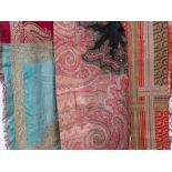 Large mixed lot of antique textiles including paisley, oriental and embossed fabrics.