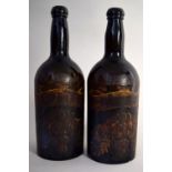 Two mid Victorian three part molded green glass wine bottles with gilt and painted labels with