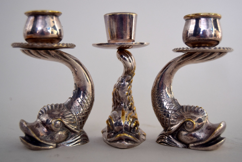 A set of three Maltese silver plated dolphin candelsticks mid 20th century, singed F.