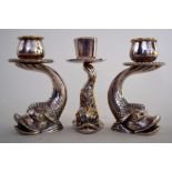 A set of three Maltese silver plated dolphin candelsticks mid 20th century, singed F.