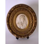 A Baroque white marble carved portrait bust of a gentleman wearing a full bottomed wig and