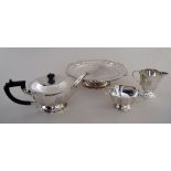 An Art Deco style tea service with rounded cut out corner and ebonised handle and finial including