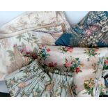 A quantity of antique and vintage cotton and linen curtain panels and fabric oddments.