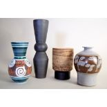 A stoneware vase by Eileen Lewenstein of cylindrical form with an incised glazed spinal decor on a