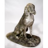 A weathered stone figure of a seated hound 90 x 90cmH