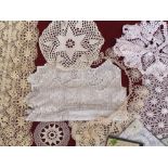 A quantity of vintage crocheted and linen tableware and coasters including Nottingham lace pieces.