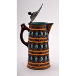 A Wedgwood majolica 'caterer' jug of typical form painted with coloured glazes of blue,