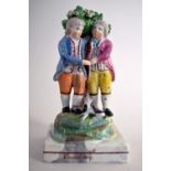 A George III pearlware 'Friendship' group by Walton of two two boys in front of a bocage a cat at